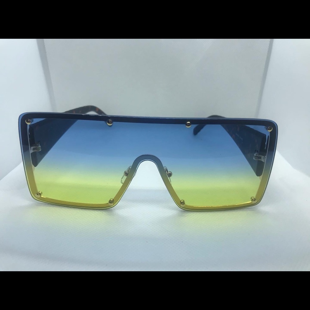 Fashionable sunglasses mix shade of blue and yellow.
